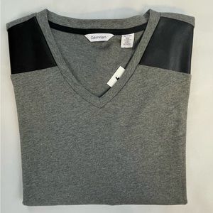 Calvin Klein V-neck tee with faux leather shoulder accents